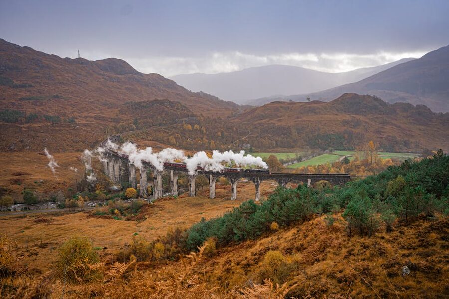 Steam train crossing Glenfinnan Viaduct