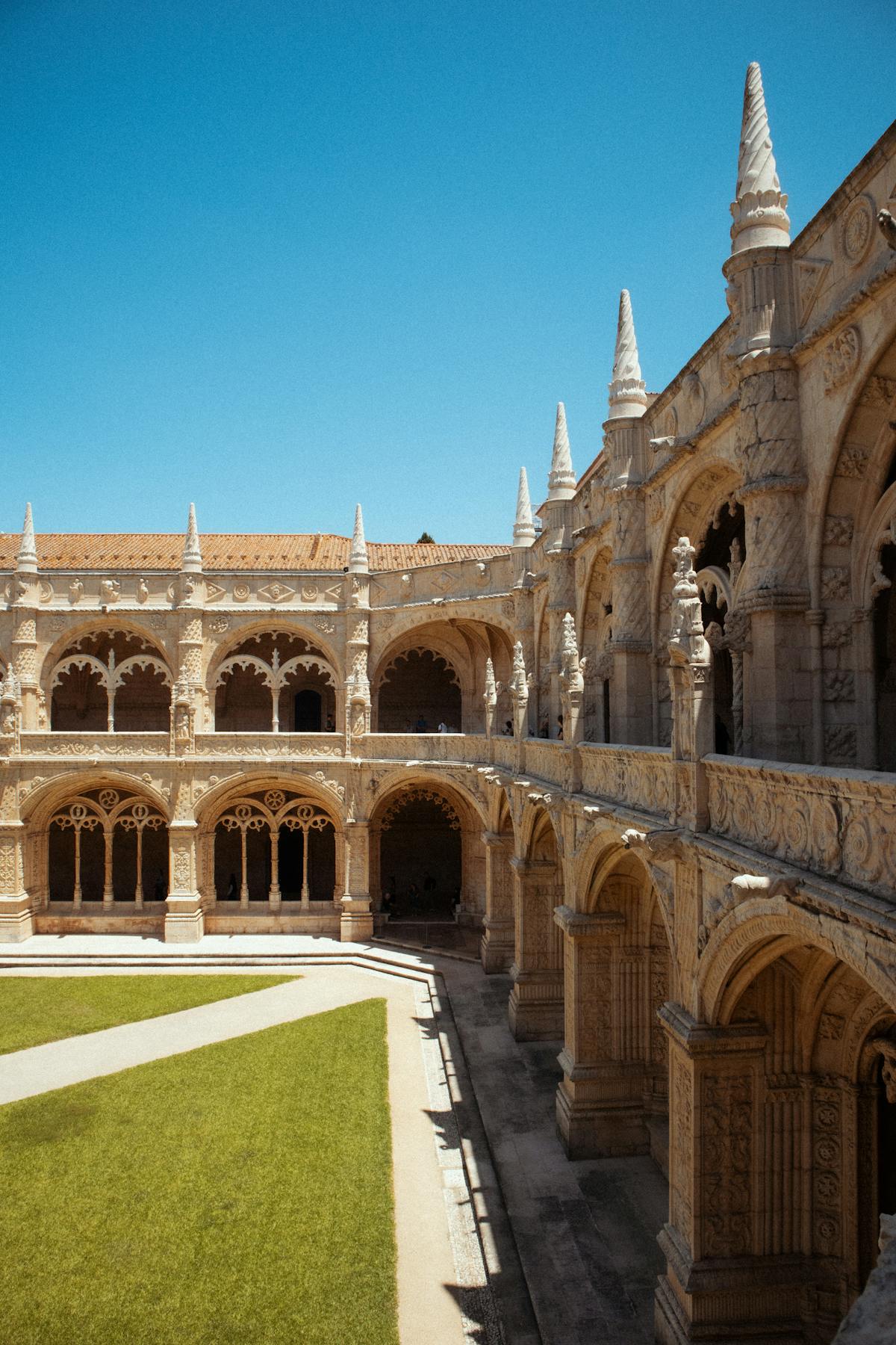 Intricate Gothic arched stonework inside Jeronimos Monastery