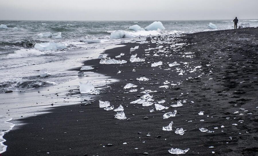 Gray iceberg piece on Diamond Beach Iceland black sand