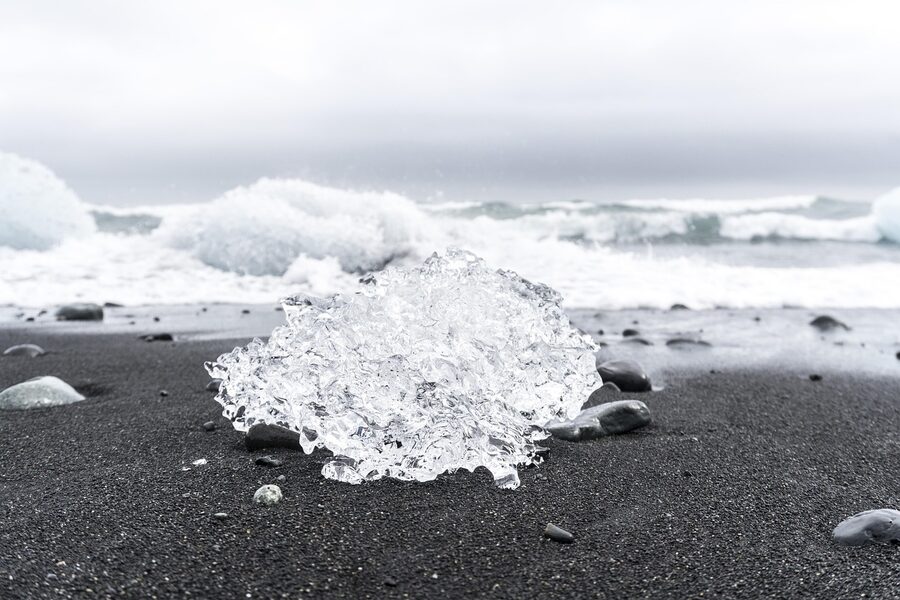 Ice castle iceberg on Diamond Beach black sand Iceland