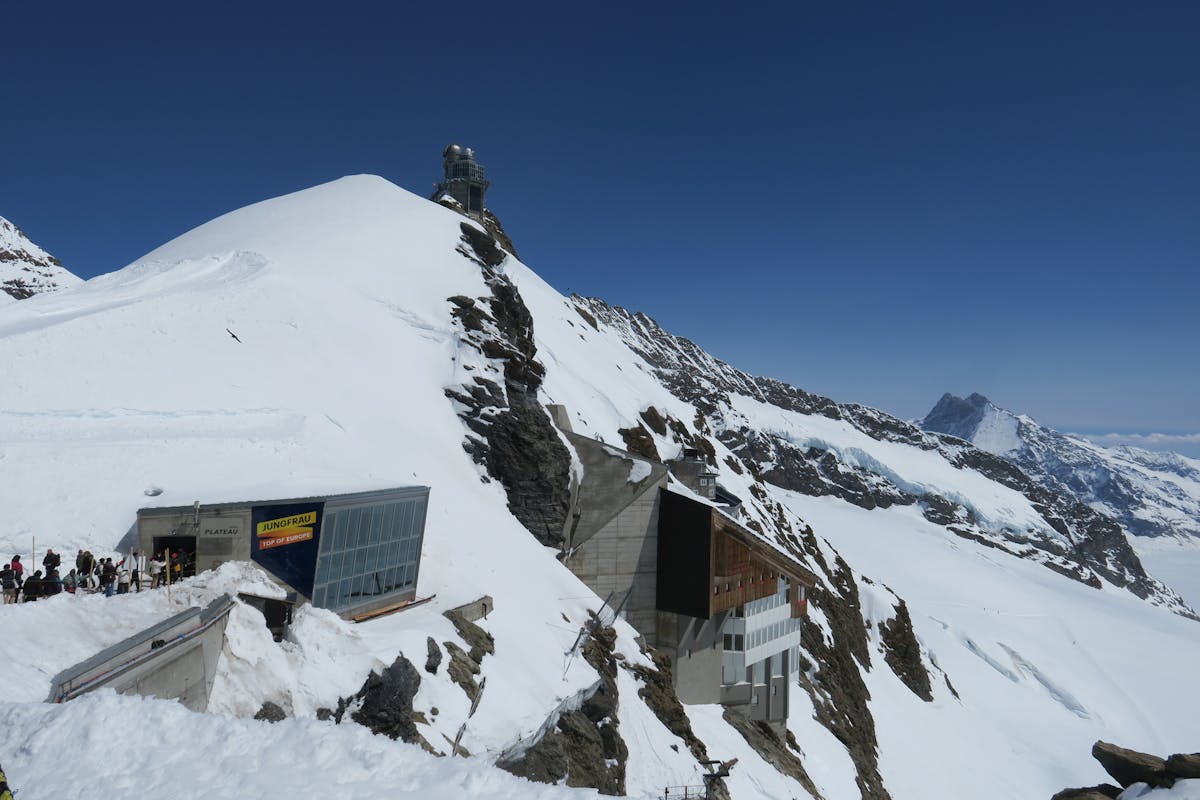 Snow-covered peaks and observation deck at Jungfraujoch Top of Europe in the Swiss Alps
