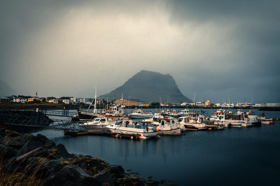 Kirkjufell with boats and fog at Grundarfjordur
