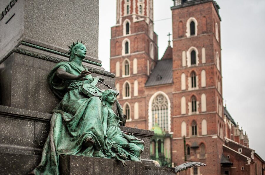 Statue and St Marys Basilica Krakow