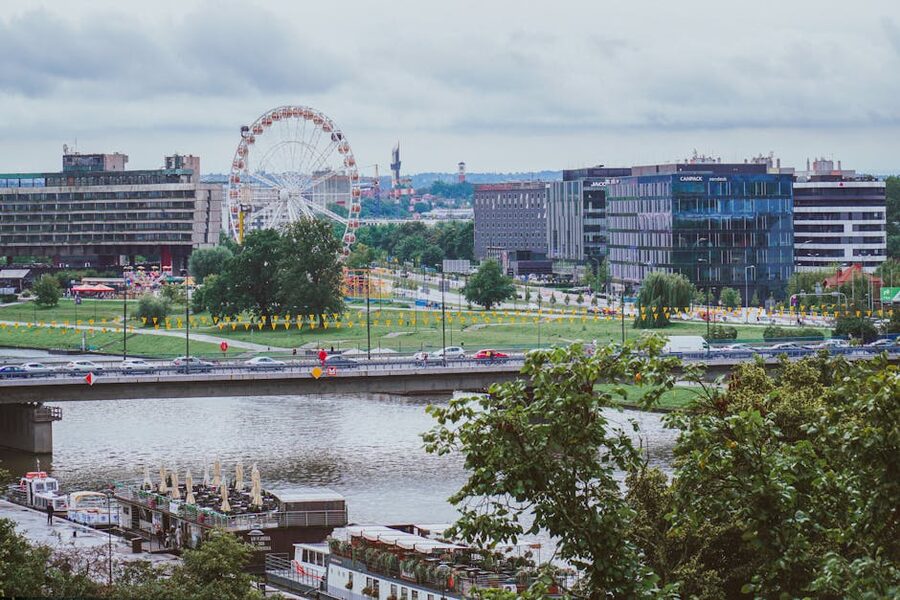 Krakow bridge and ferris wheel at dusk