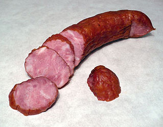 Polish kielbasa sausage on a wooden cutting board