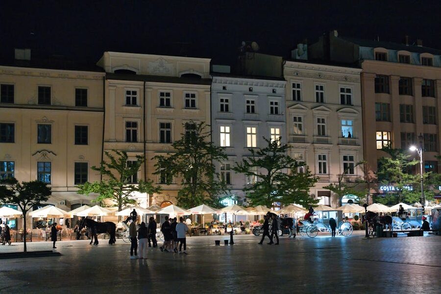 Krakow Main Market Square at night with illuminated arches