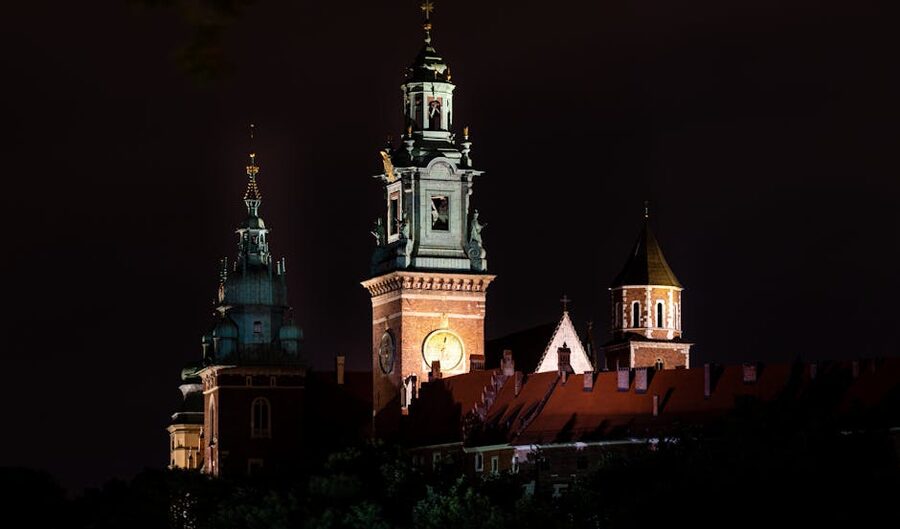 Wawel Royal Castle illuminated at night in Krakow