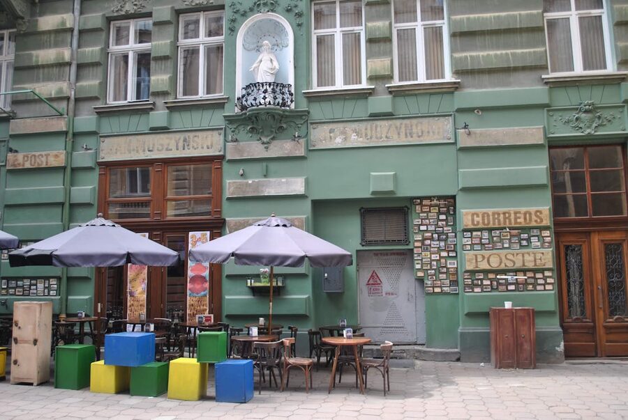 Kazimierz cafe with colorful chairs Krakow