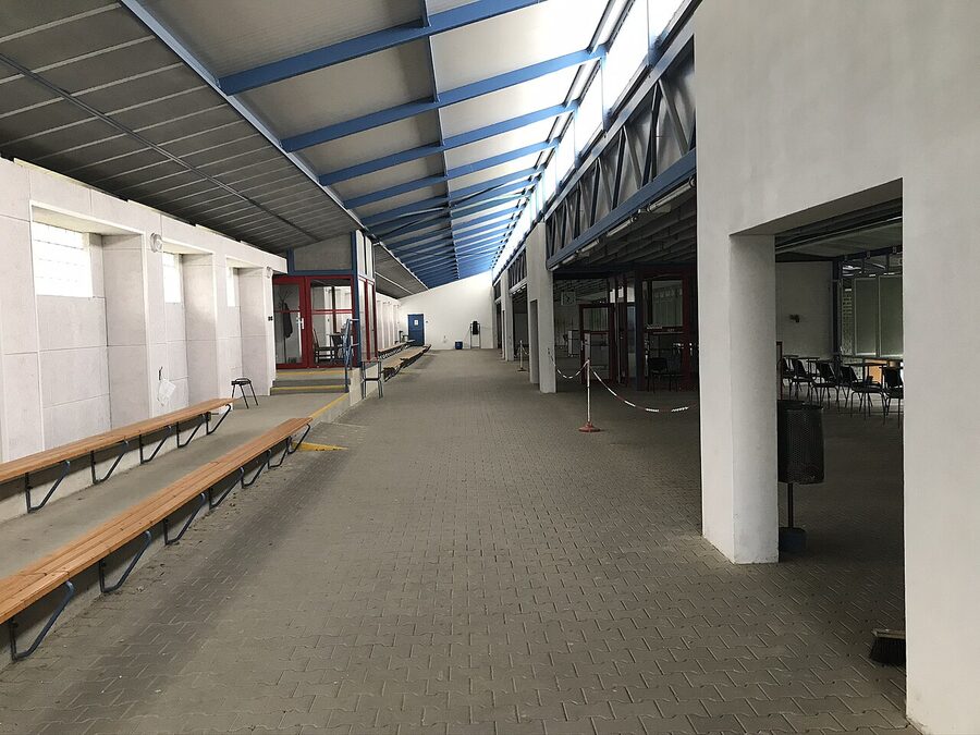 Indoor shooting range with 25 metre lanes and target rails, similar to the setup used in Krakow