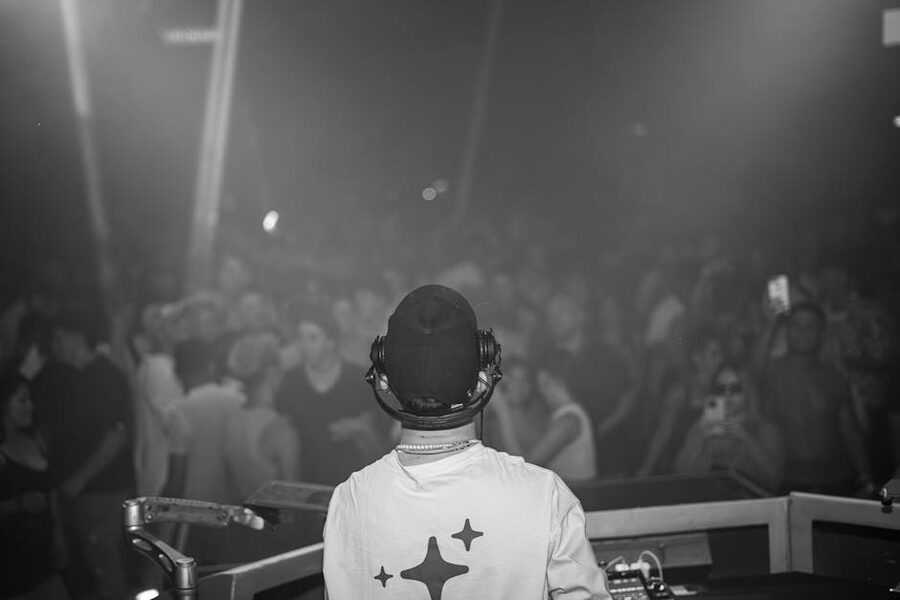 DJ playing at a Krakow club at the end of a pub crawl night