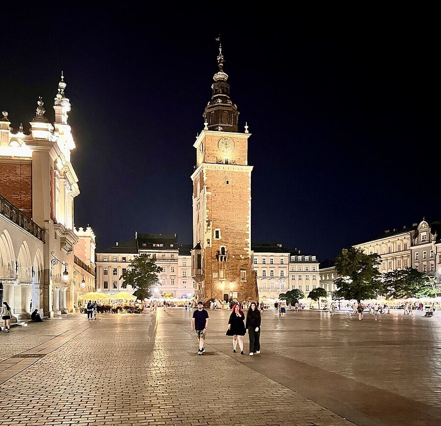 Old Town Market Square in Krakow at night with St Mary's Basilica lit up