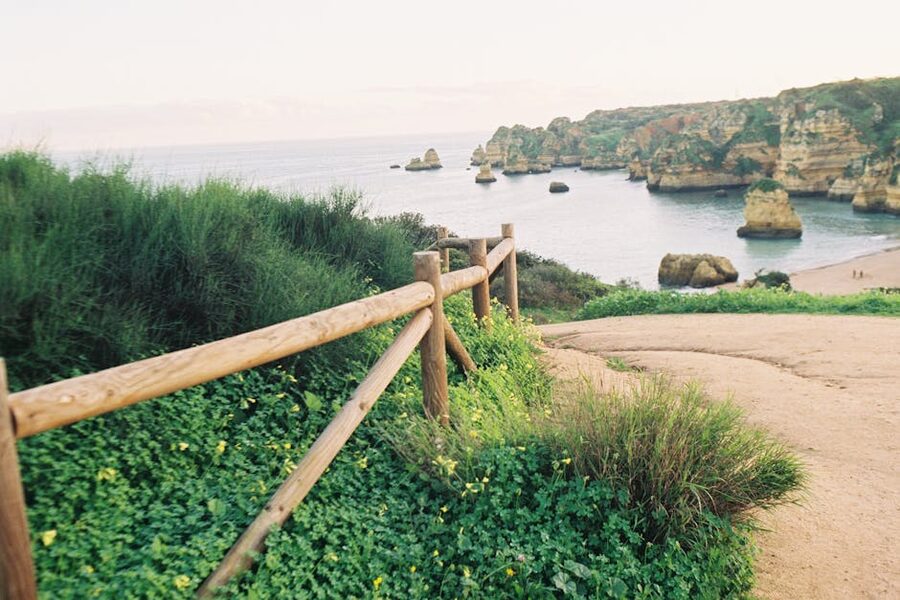 Lagos coast wooden boardwalk railing at sunrise