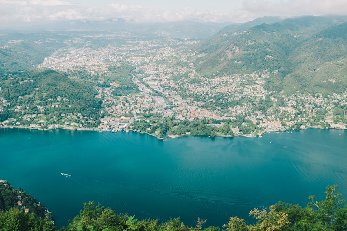 Aerial view of Lake Como surrounded by mountains in Lombardy Italy