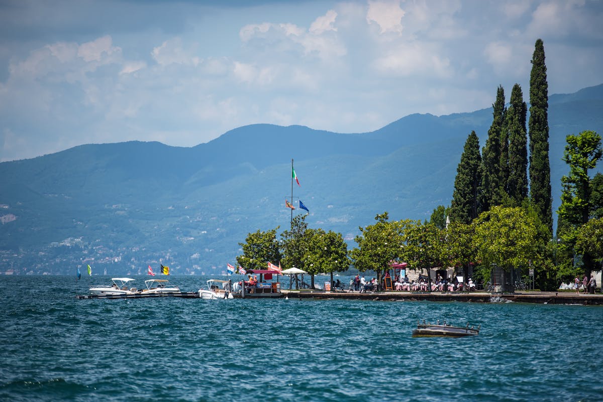 Italian lakeside town with colorful boats at Lake Garda