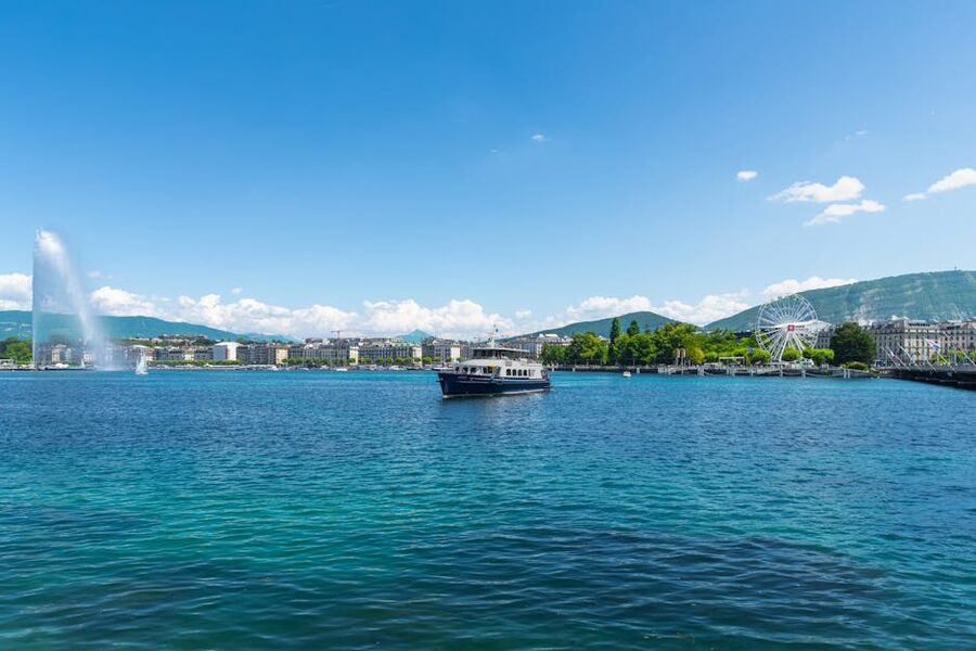 Lake Geneva with Jet d Eau fountain and Ferris wheel