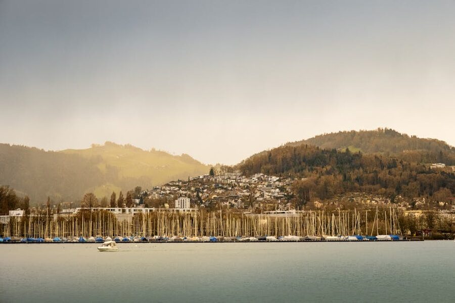 Lake Lucerne with boats docked against scenic hills