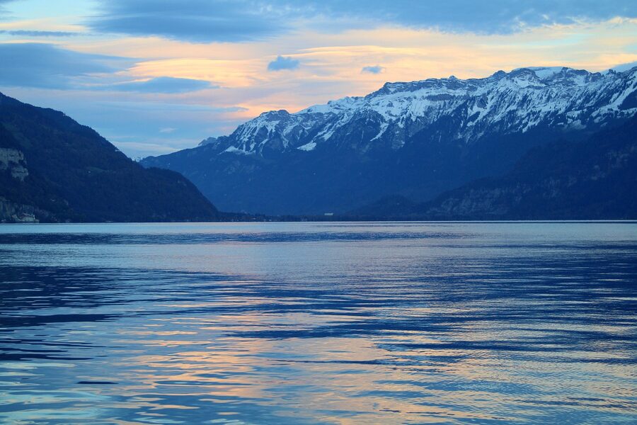 Sunset panoramic view of Lake Thun with Swiss Alps in background