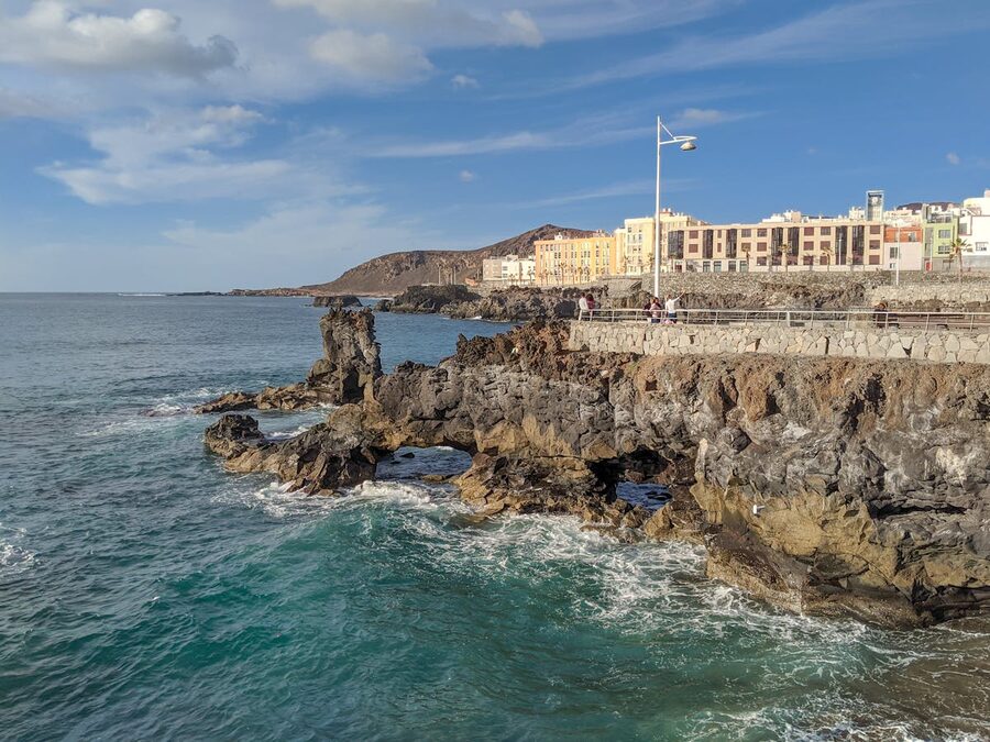 Las Palmas skyline along the Gran Canaria coast under blue sky