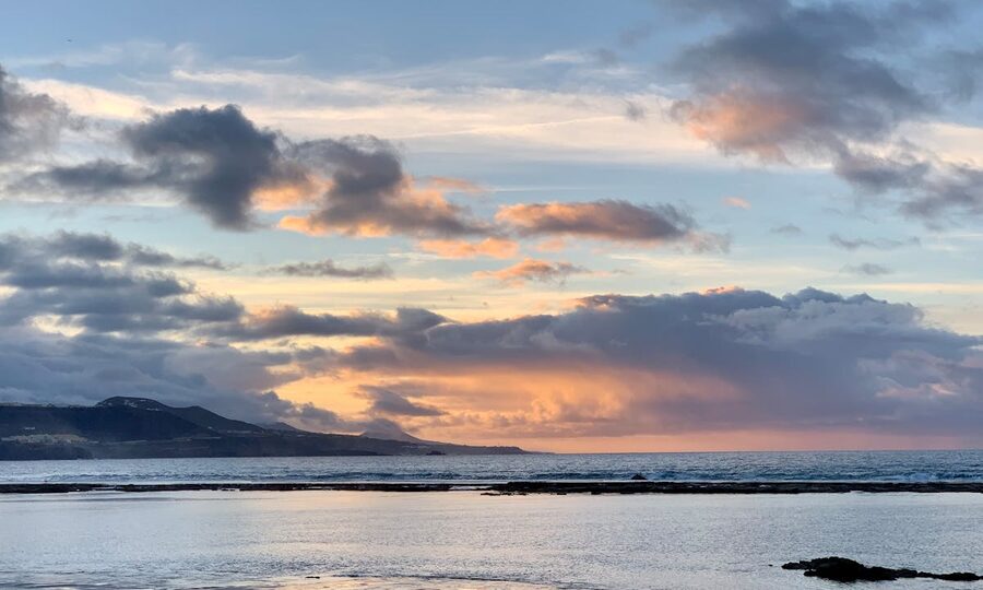 Sunset over Las Palmas with clouds reflecting on the Atlantic Ocean