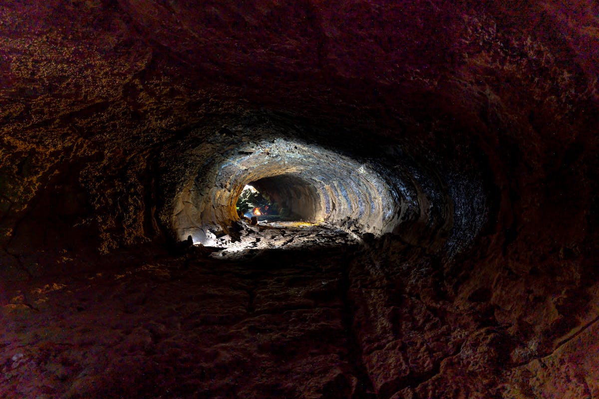 Interior of natural lava tube cave with textured rock formations
