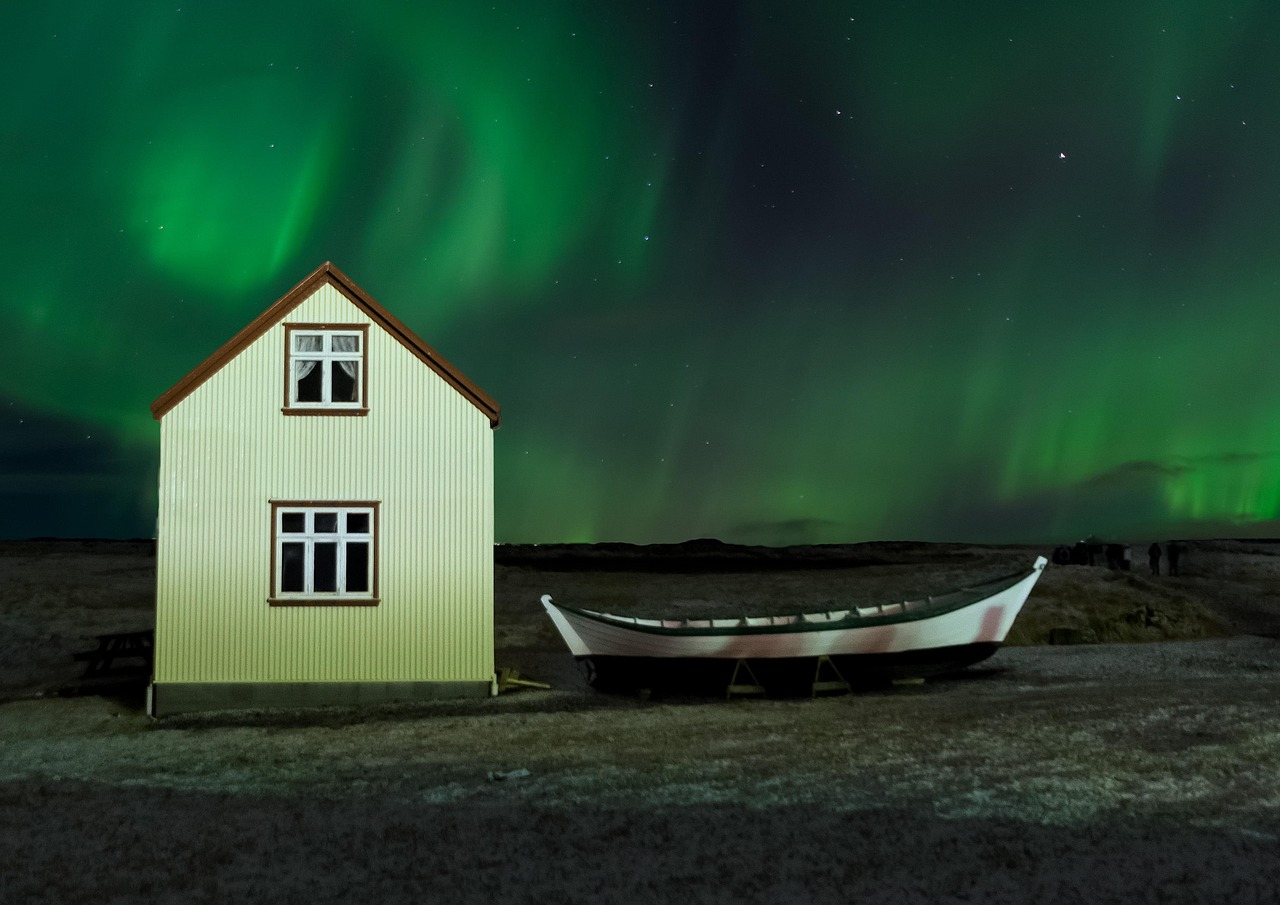 Northern lights aurora borealis glowing green over Iceland at night