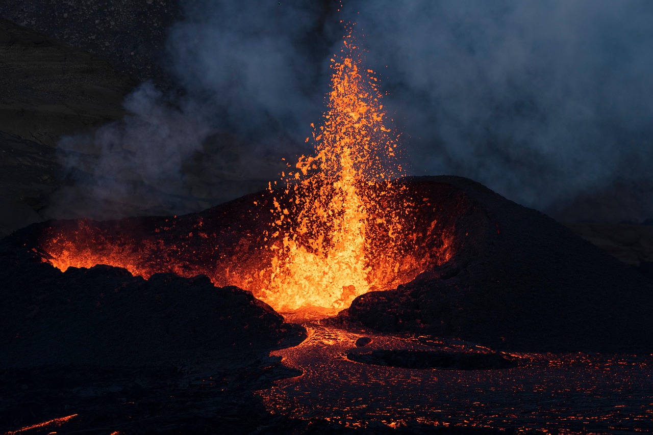 Active volcano erupting with bright molten lava in Iceland