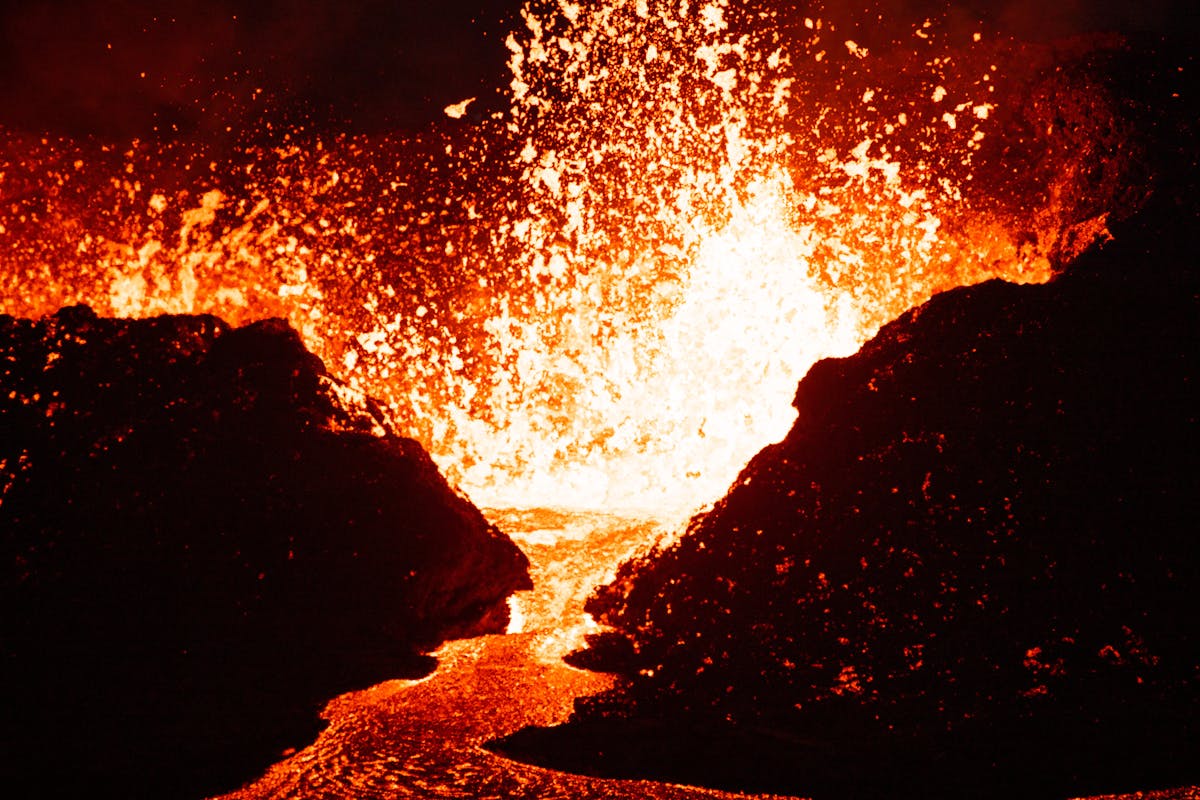 Close-up of powerful volcanic eruption with intense glowing lava and heat