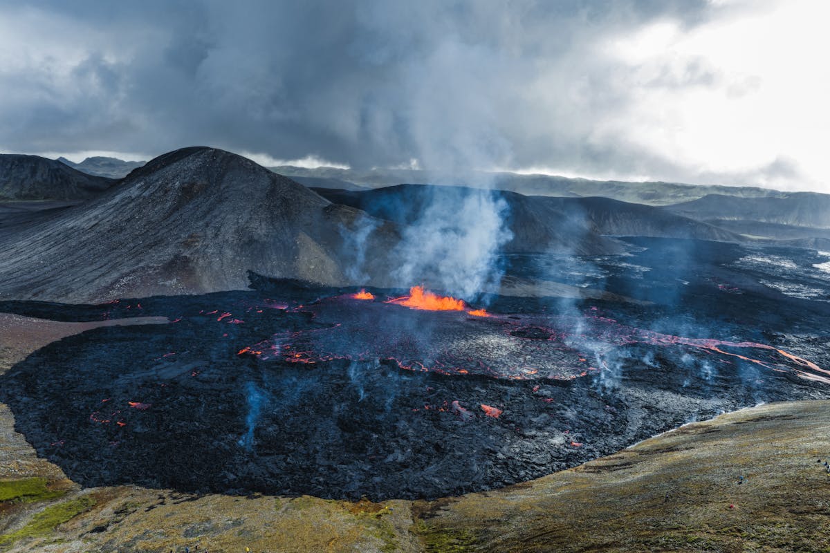 Aerial view of active volcano erupting in Iceland with flowing lava