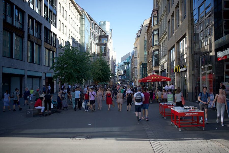 Leipzig crowded urban pedestrian scene sunny