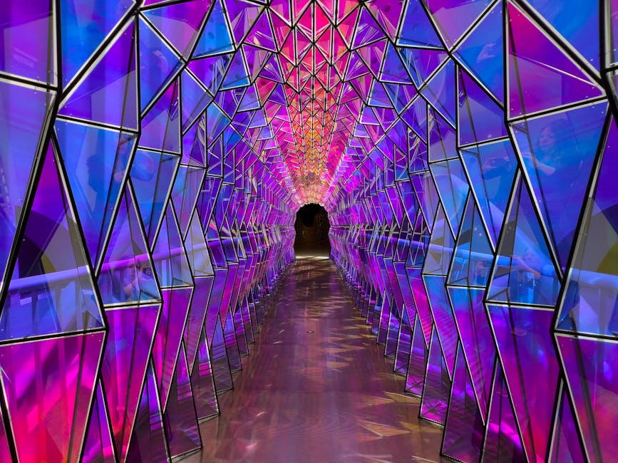 Geometric tunnel illuminated with purple and blue lights