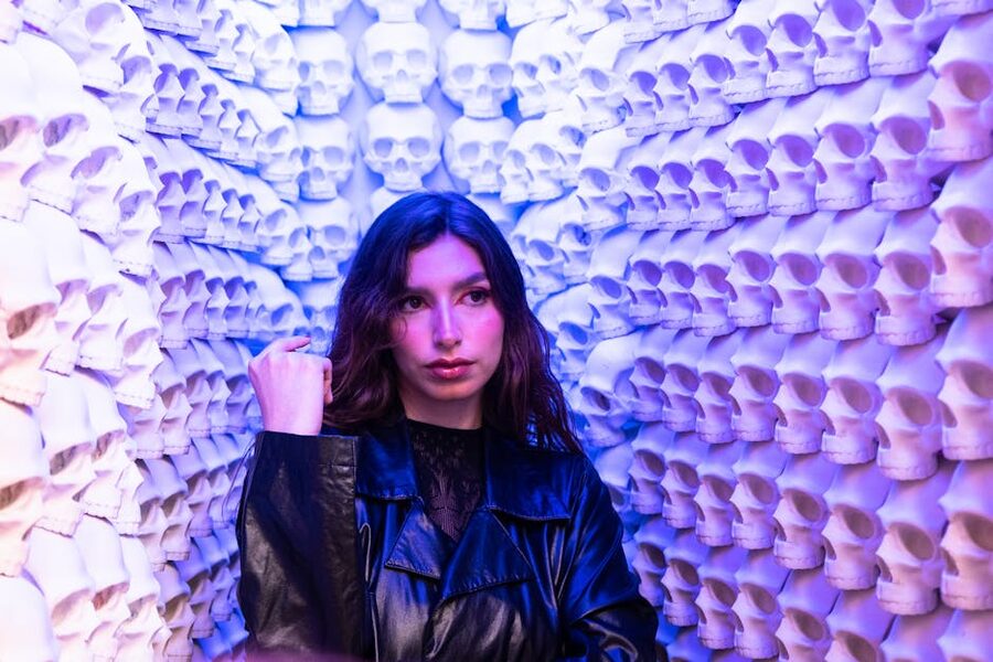 Visitor in a colorful art installation with theatrical lighting