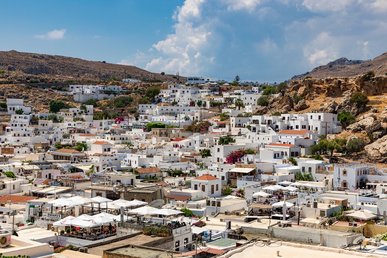 White village of Lindos cascading down to the turquoise bay