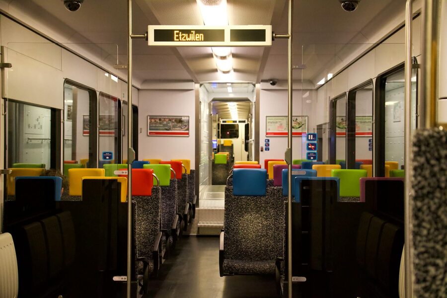 Interior of a modern Swiss train with colourful seats