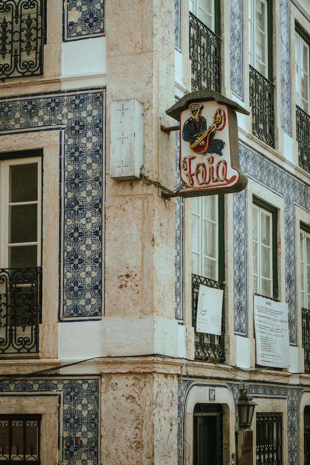 Lisbon neighborhood at evening with warm street lights and historic architecture
