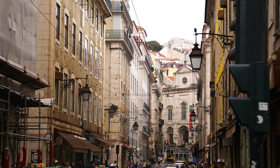 Old town Lisbon street with tram and architecture