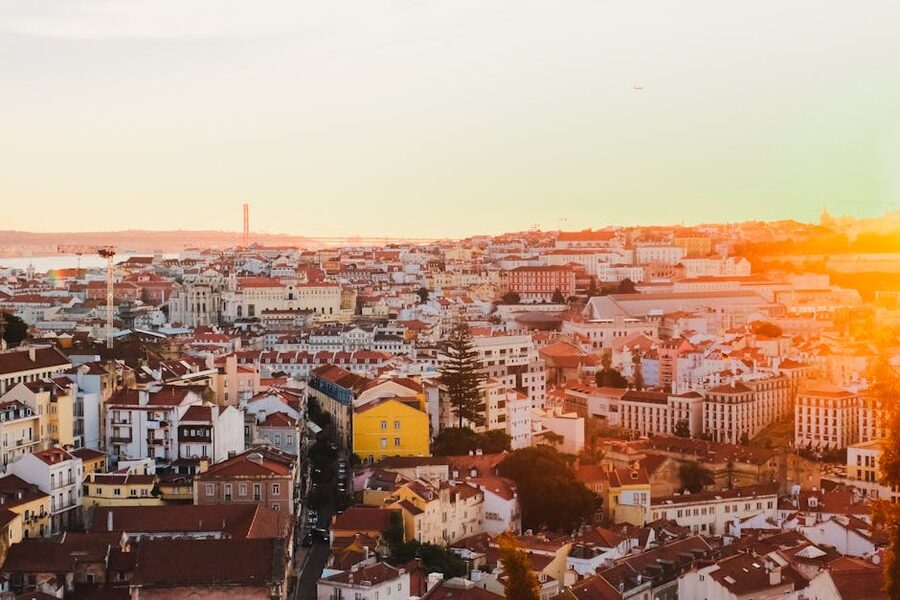 Sunlit Lisbon rooftops and architecture at sunset