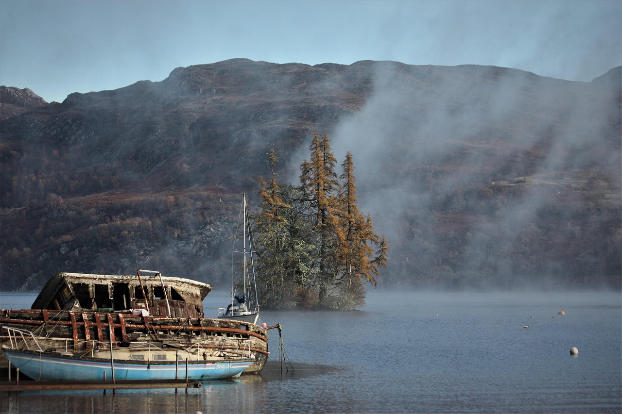 A small boat on Loch Ness with dramatic clouds overhead