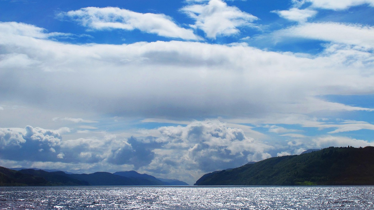 Wide panoramic view of Loch Ness and its surrounding hills
