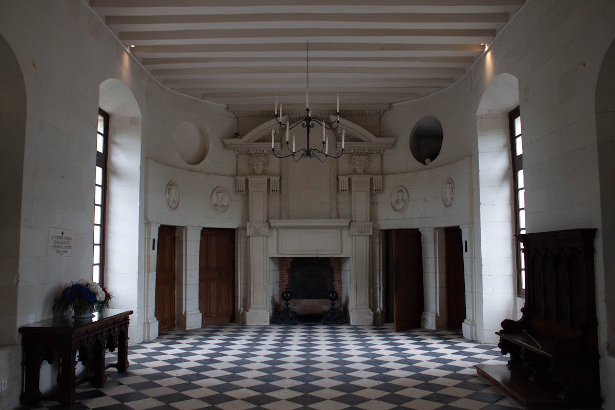 Elegant hall inside Chenonceau Castle with black and white checkered floor