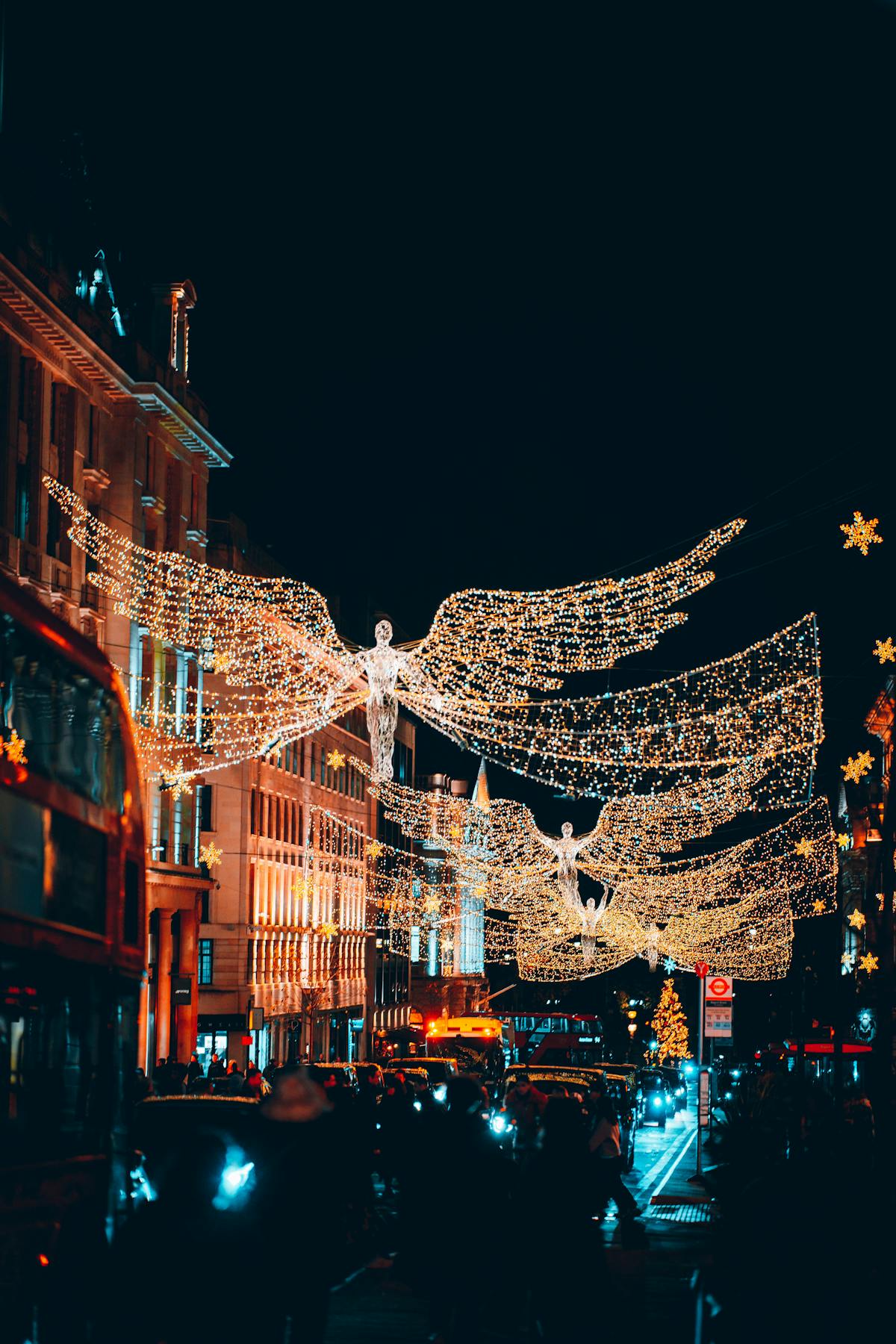 Christmas angel light decorations illuminating a London street at night