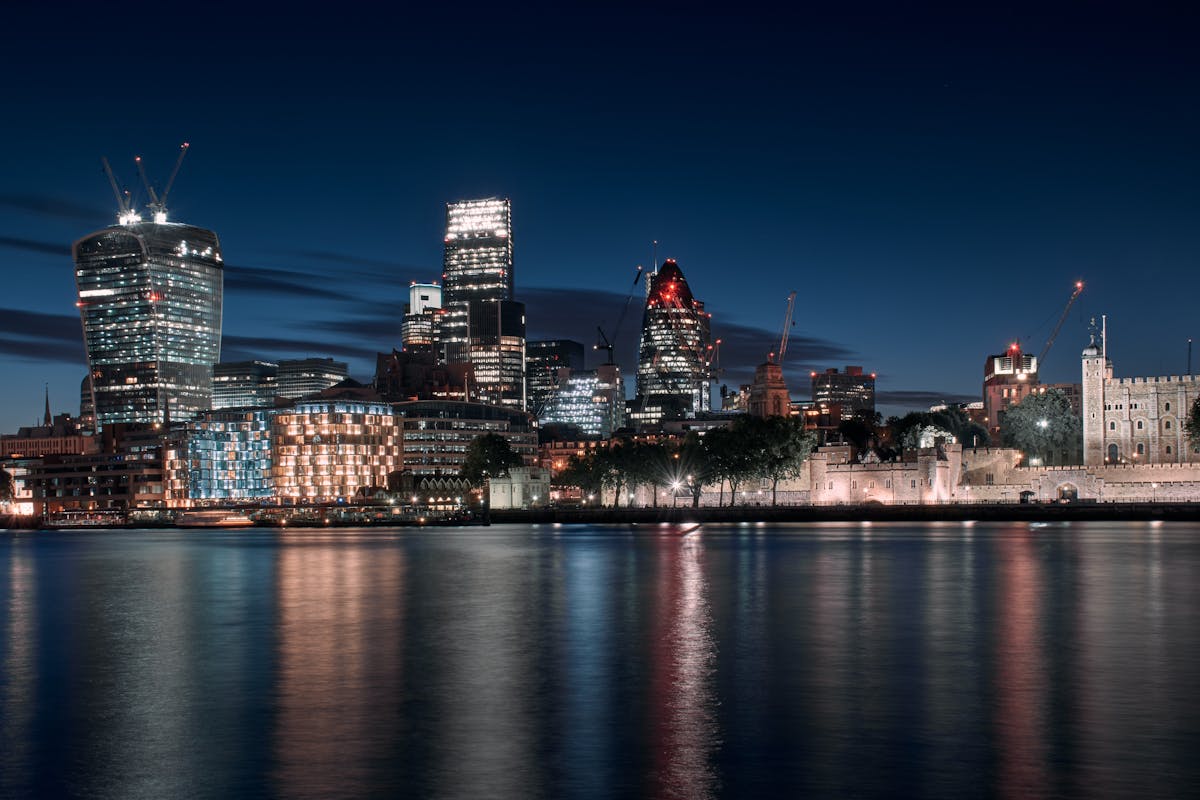 London city lights reflected in the Thames after dark