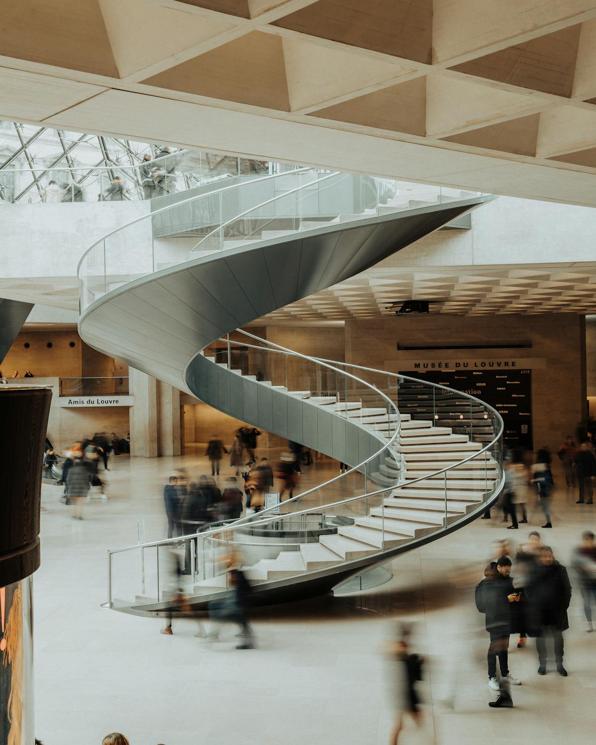 Modern spiral staircase inside the Louvre Museum
