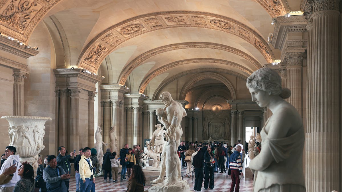 Hall of classical statues inside the Louvre Museum