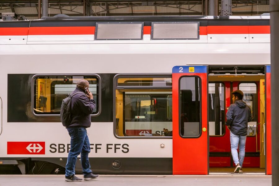 Travelers boarding SBB train at Lucerne station