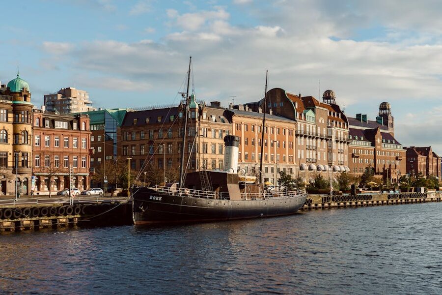 Historic steamship docked at Malmö waterfront in autumn