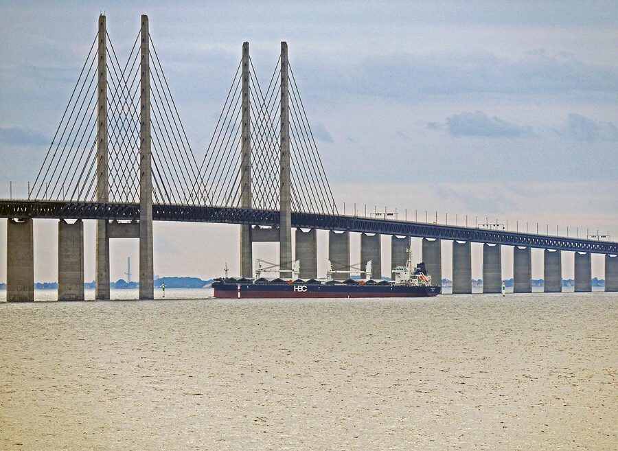 Oresund Bridge with cargo ship passing underneath