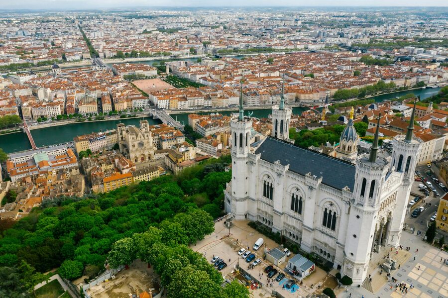 Aerial view of Lyon featuring the Basilica of Notre-Dame de Fourviere on the hilltop above the old town