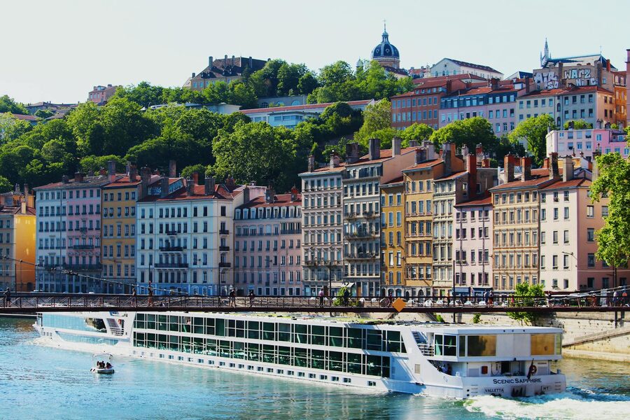 Colorful buildings lining the river in Lyon France