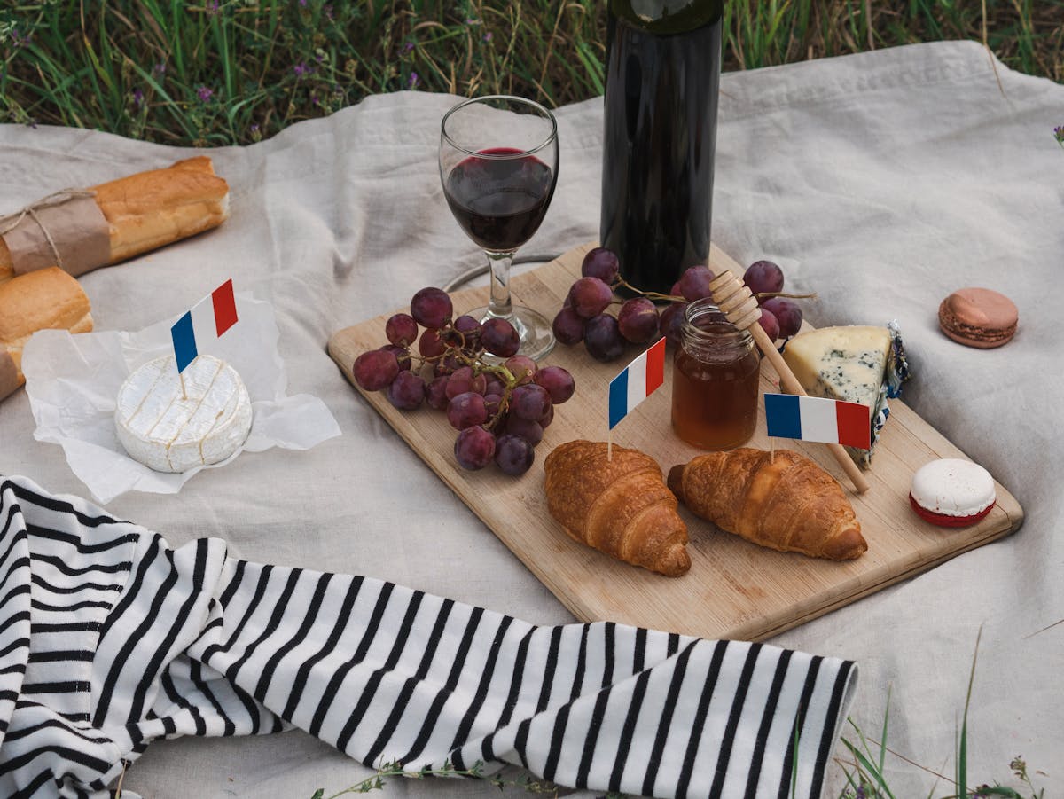 French food spread with cheese wine and bread