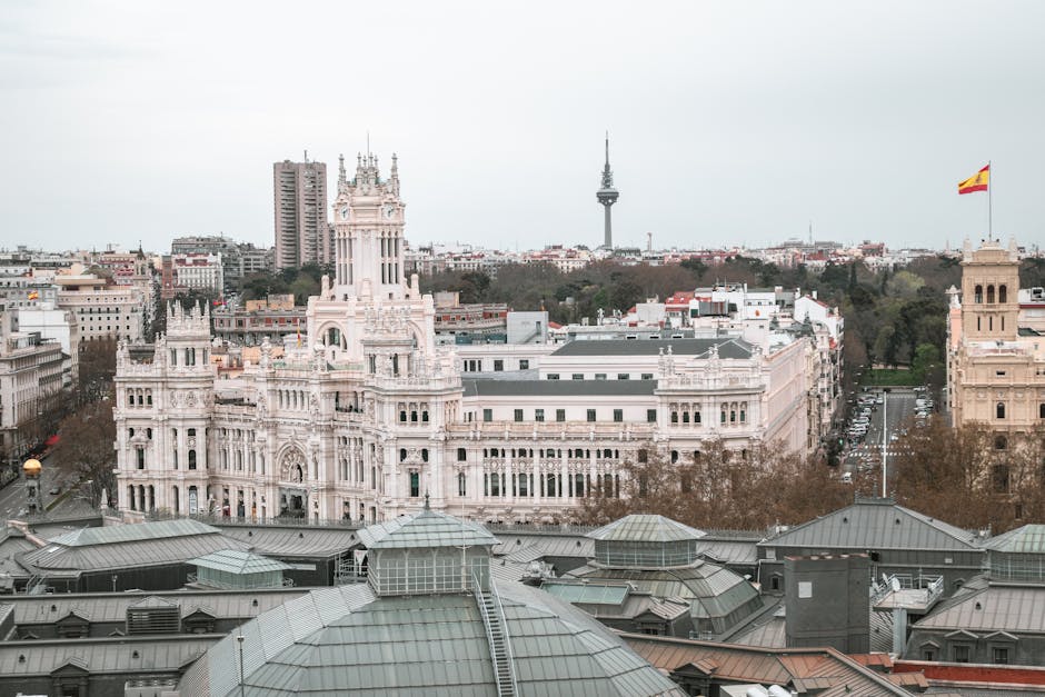 The Palacio de Cibeles building in Madrid with its ornate towers and clock face